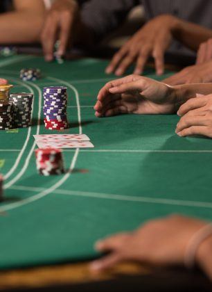 Player winning chip by betting baccarat with banker hand